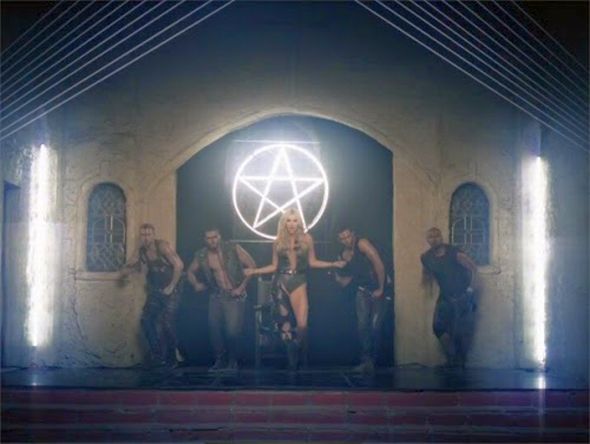 This snapshot from the music video ‘Die Young’ by pop singer Kesha is a good example of how symbols of light are demonized. The symbol of an upright pentagram hangs in an old church where Kesha engages in orgiastic acts.