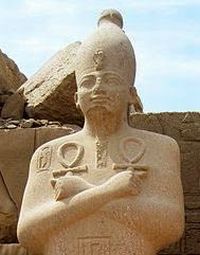 An ancient statue of Osiris with his right arm crossed over his left (copyright Olaf Tausch 1April2009).