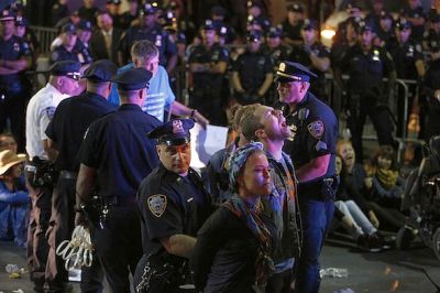  Protesters chant as they are arrested at the intersection of Wall Street and Broad Street in New York on Sept. 22. The protesters, many of whom were affiliated with Occupy Wall Street, were pointing to the connection between capitalism and environmental destruction. AP/Seth Wenig